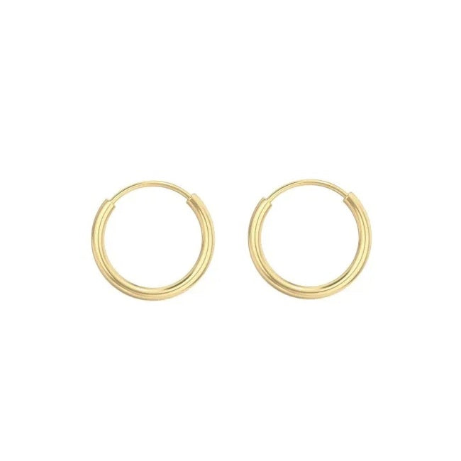 Gold endless hoop earrings on a white background