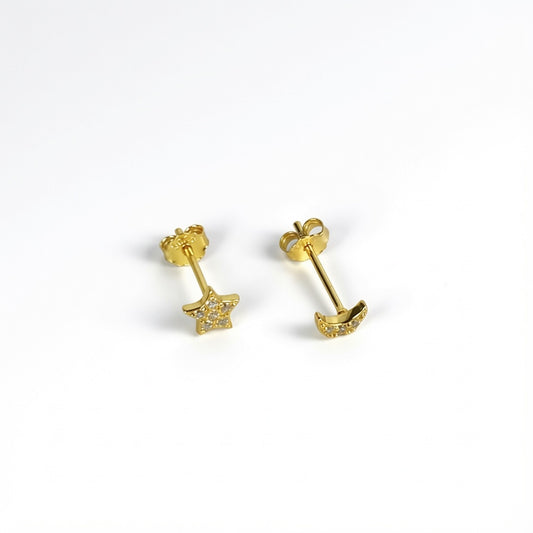 14ct Gold Crystal Star and Moon Mismatched Stud Earrings with zircon stones on a white backround
