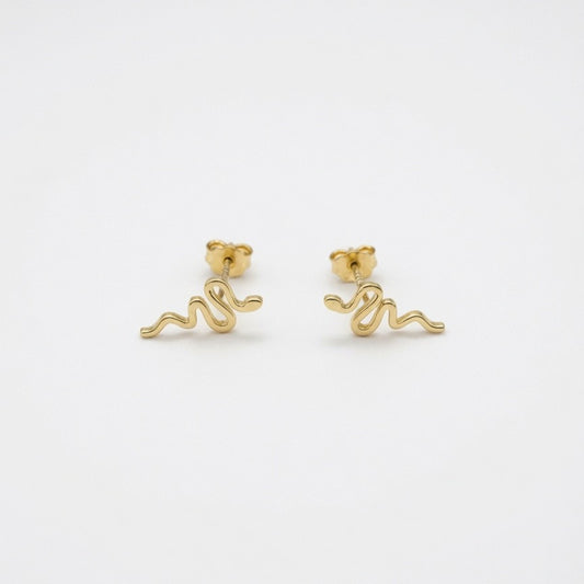Gold Snake Shaped Sud Earrings On  White Backround  