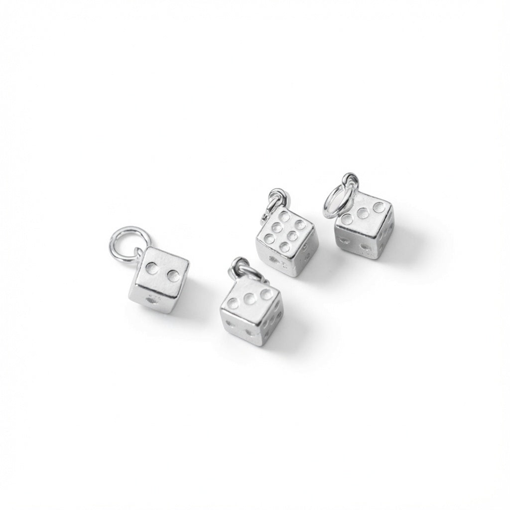 Four 925 sterling silver dice charms pendant with attached small jump rings, displayed on a clean white background.