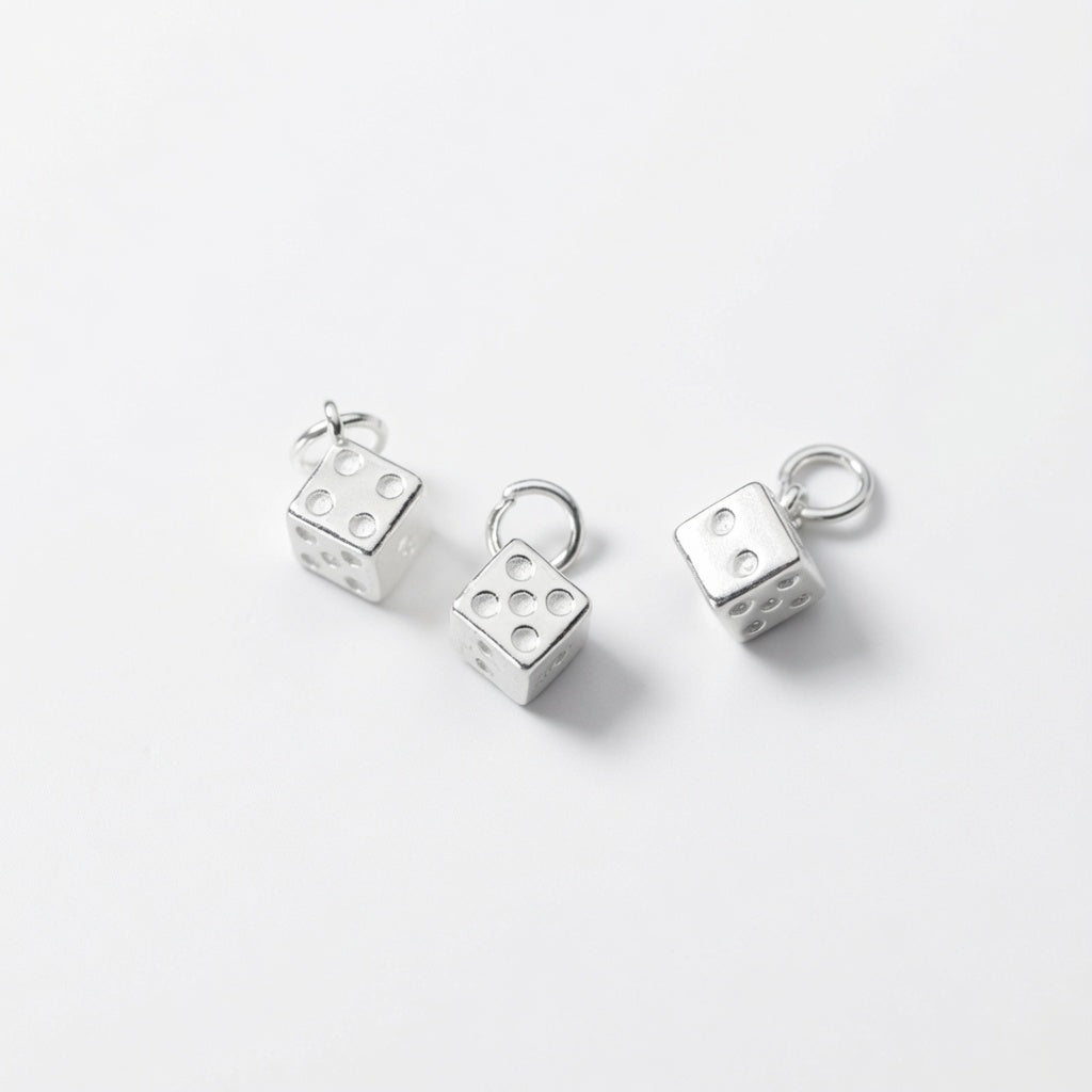 925 sterling silver dice charms with attached closed jump rings, displayed on a clean white background.