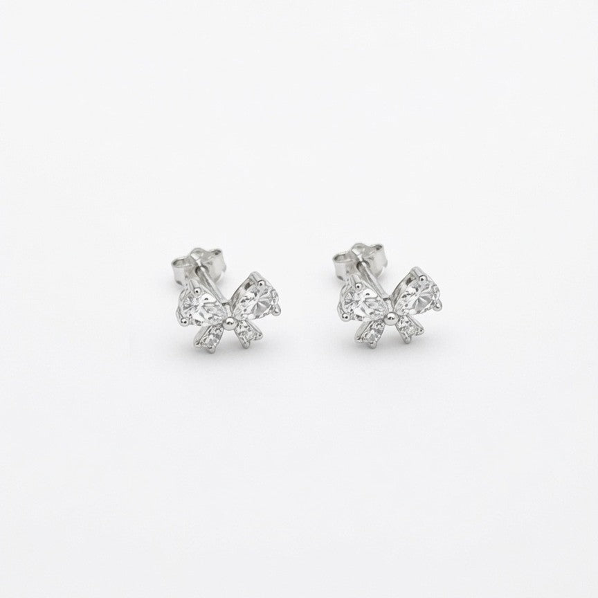 A pair of 925 sterling silver crystal bow stud earrings with sparkling cubic zirconia stones, shown on a plain white background.