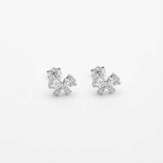 A pair of 925 sterling silver crystal bow stud earrings with sparkling cubic zirconia stones, shown on a plain white background.