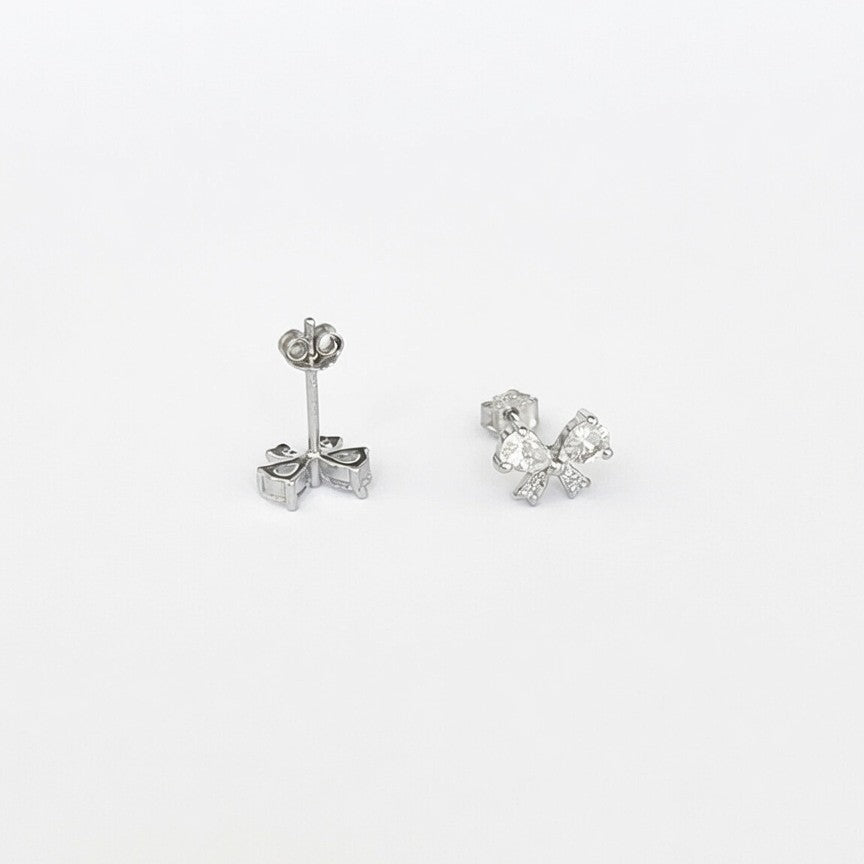 A pair of 925 sterling silver stud earrings on a plain white background, showing both the front and the back post and butterfly backing.