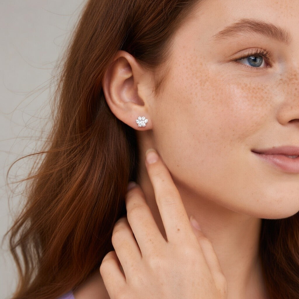925 sterling silver crystal paw print stud earrings worn on ear lifestyle shot Agnes and Simon