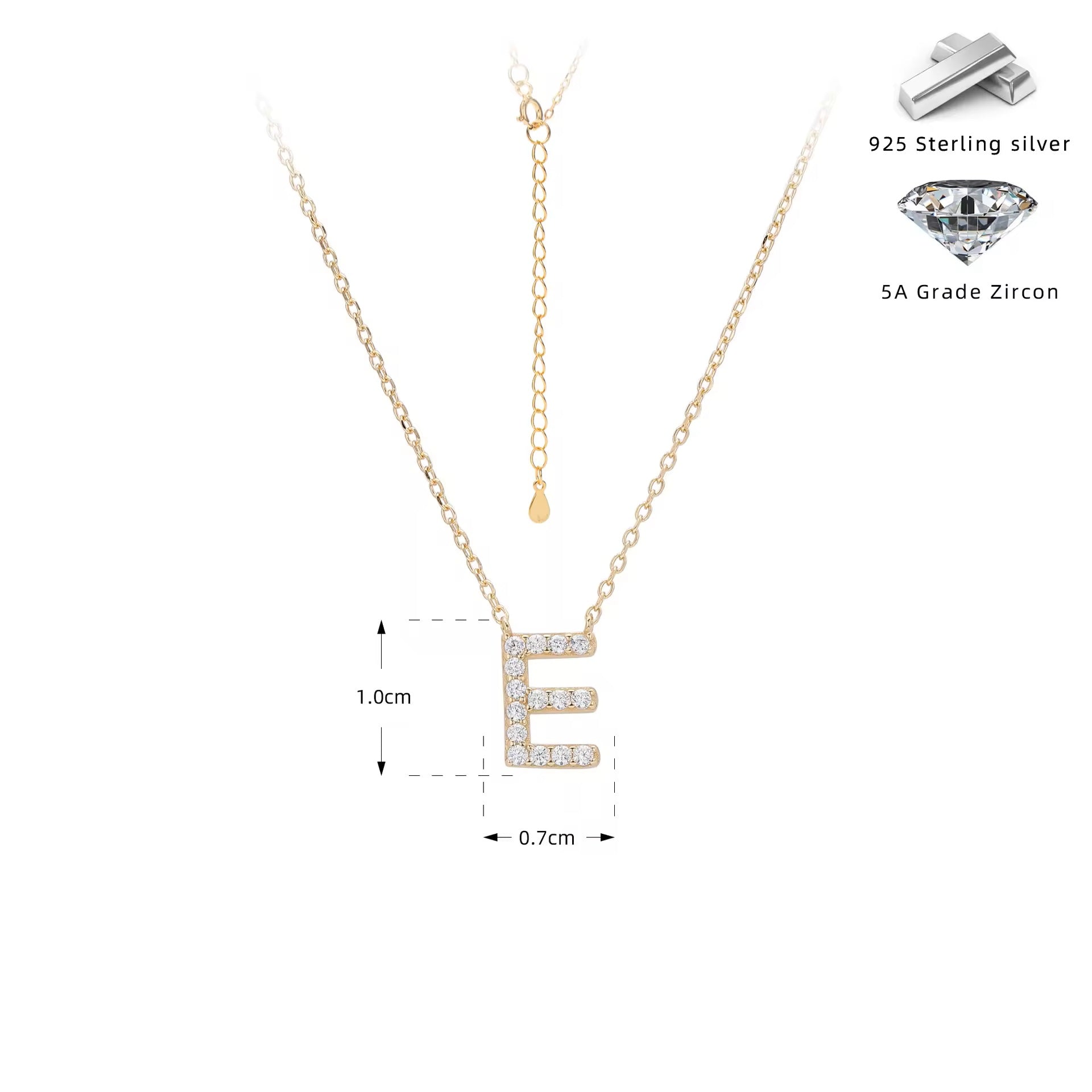 Gold necklace with crystal letter 'E' pendant on a white background