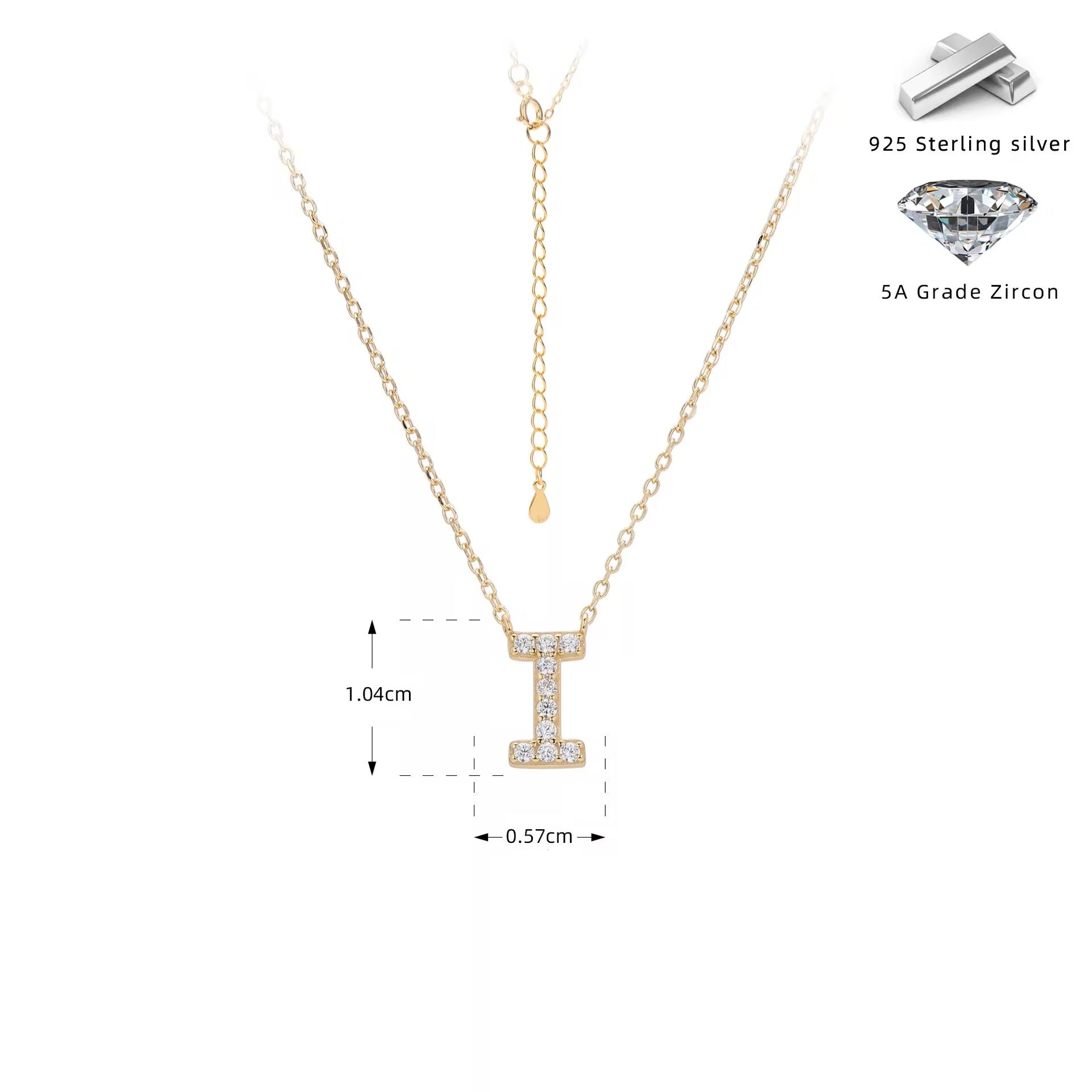 Gold necklace with crystal letter 'I' pendant on a white background