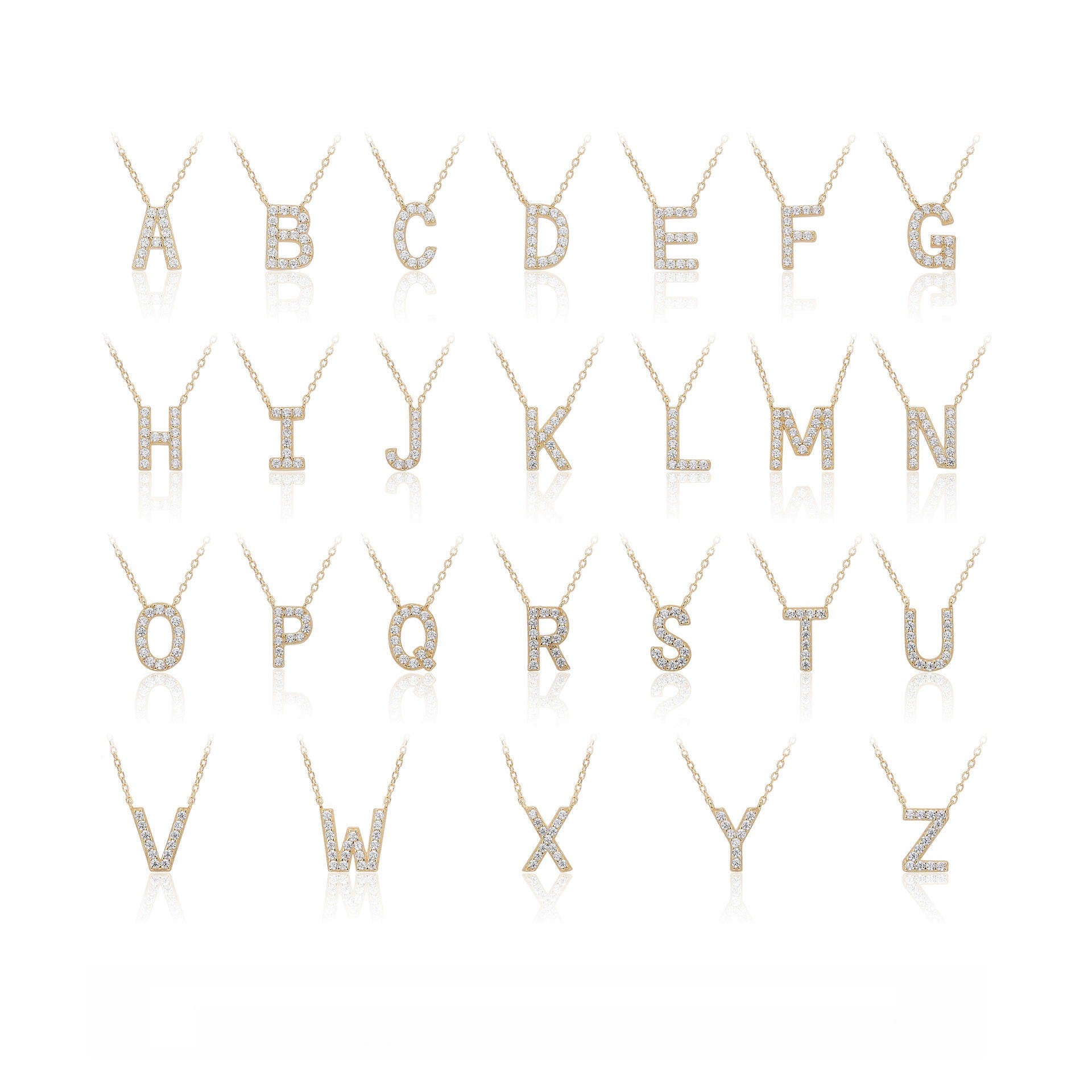 Diamond-studded gold letter necklaces from A to Z on a white background