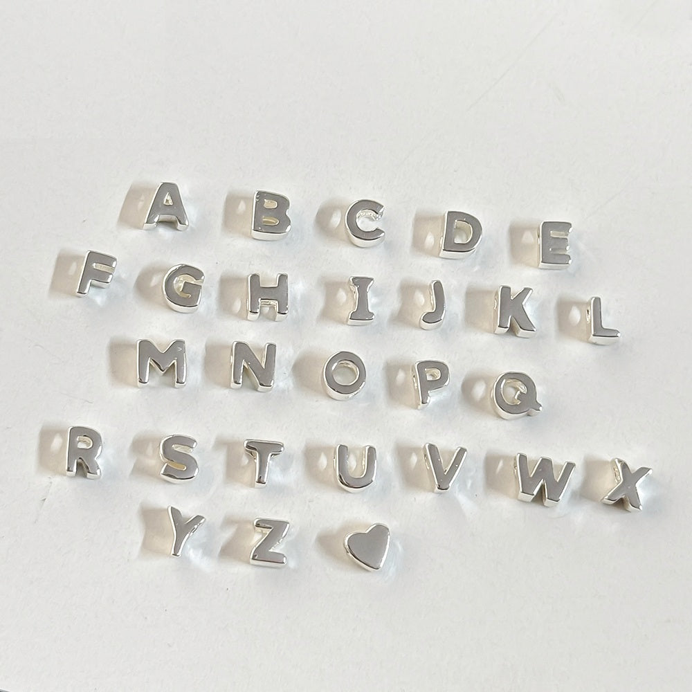 925 sterling silver slider beads a-z letter charms on a white background