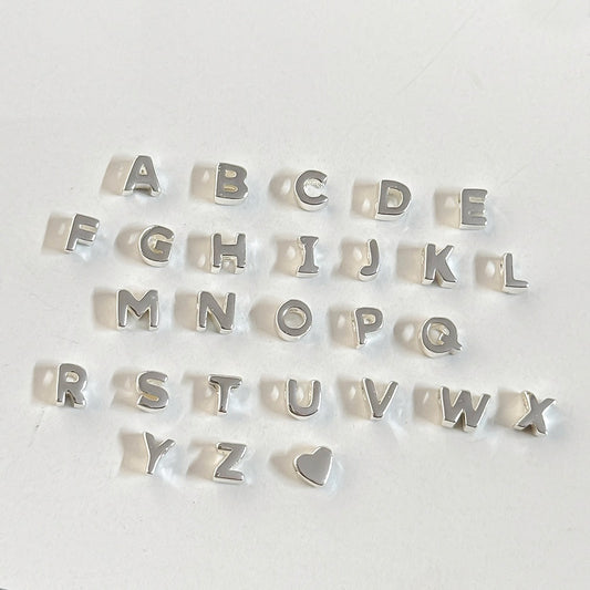 925 sterling silver slider beads a-z letter charms on a white background