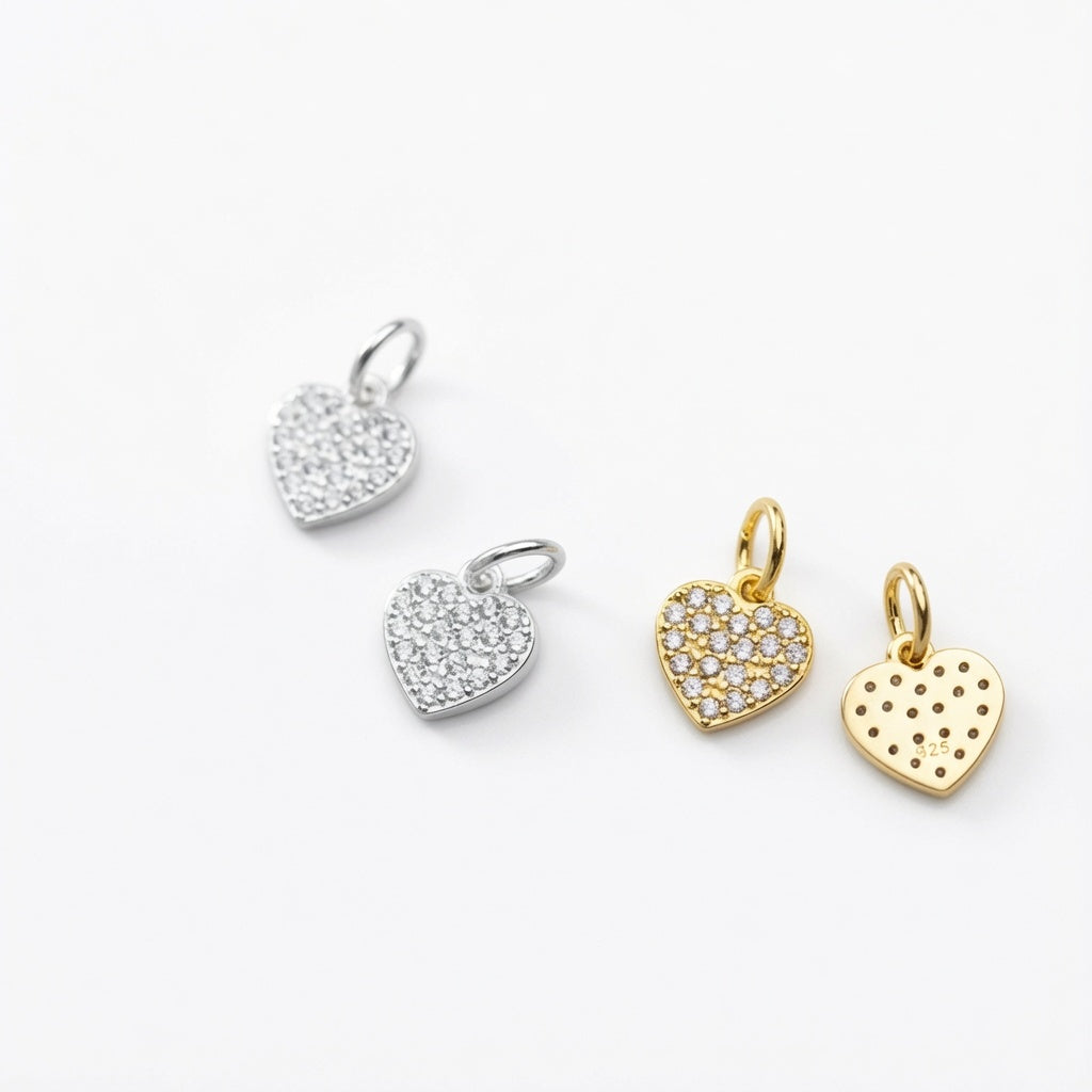 14ct gold plated and 925 sterling silver zircon heart charm pendants side by side